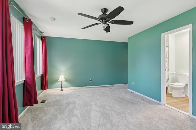 4927 Oxford Ct, Bensalem, PA 19020 - unfurnished bedroom with visible vents, a ceiling fan, baseboards, connected bathroom, and carpet flooring