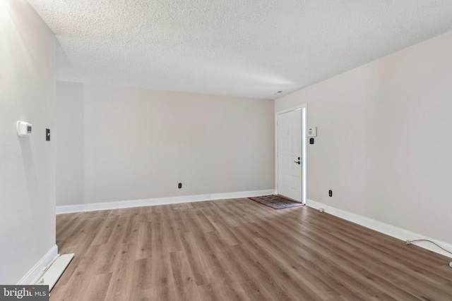 4927 Oxford Ct, Bensalem, PA 19020 - interior space with baseboards, a textured ceiling, and light wood-style flooring
