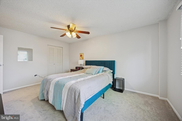 bedroom featuring a closet, carpet, ceiling fan, and baseboards
