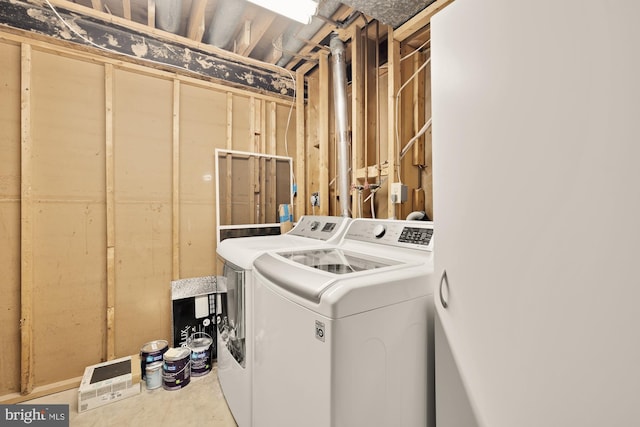 laundry room with separate washer and dryer and laundry area