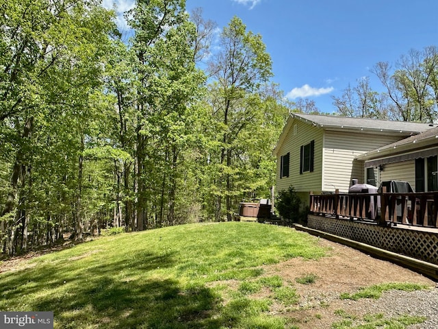 view of yard with a wooden deck