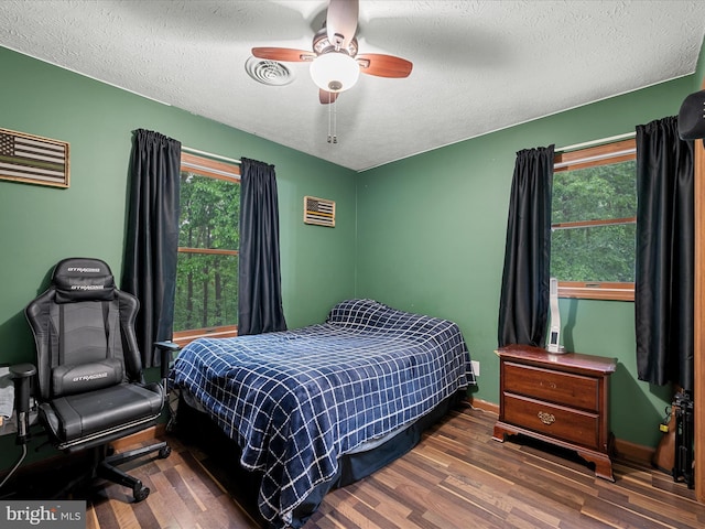 125 Ender Dr, Moorefield, WV 26836 - bedroom with wood finished floors, multiple windows, a textured ceiling, ceiling fan, and baseboards
