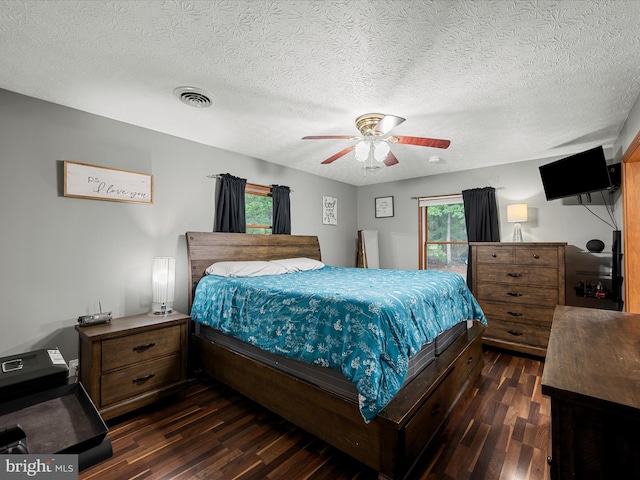 125 Ender Dr, Moorefield, WV 26836 - bedroom with dark wood finished floors, a ceiling fan, and a textured ceiling