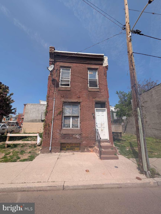 view of front of home with brick siding