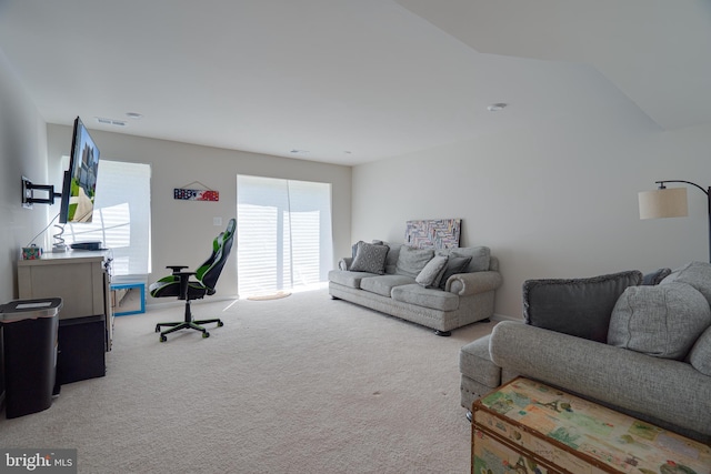 carpeted living room with baseboards and visible vents