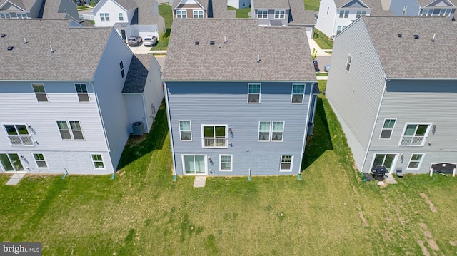 birds eye view of property with a residential view