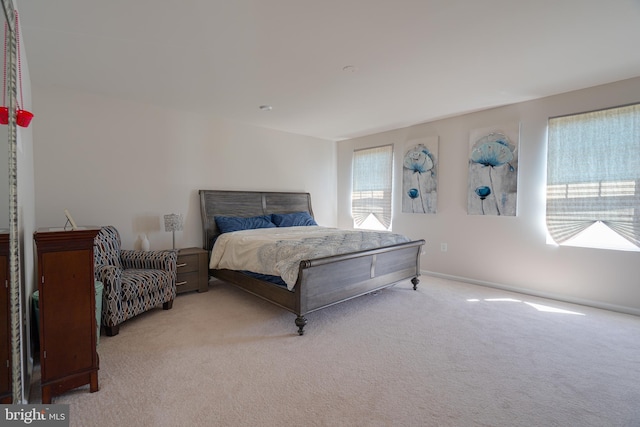 carpeted bedroom with baseboards