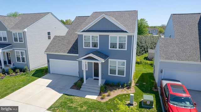 traditional-style house with a shingled roof, an attached garage, a front lawn, board and batten siding, and driveway