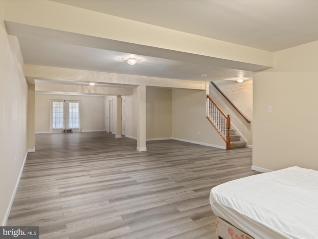 interior space featuring stairway, baseboards, and light wood-style flooring