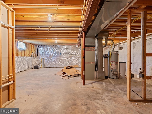 unfinished below grade area with heating unit and gas water heater