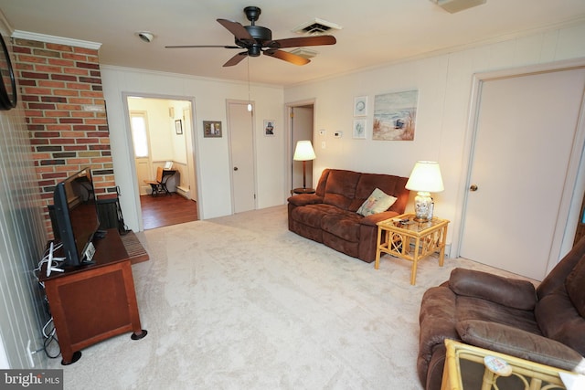 living room featuring visible vents, ornamental molding, carpet flooring, a fireplace, and a ceiling fan