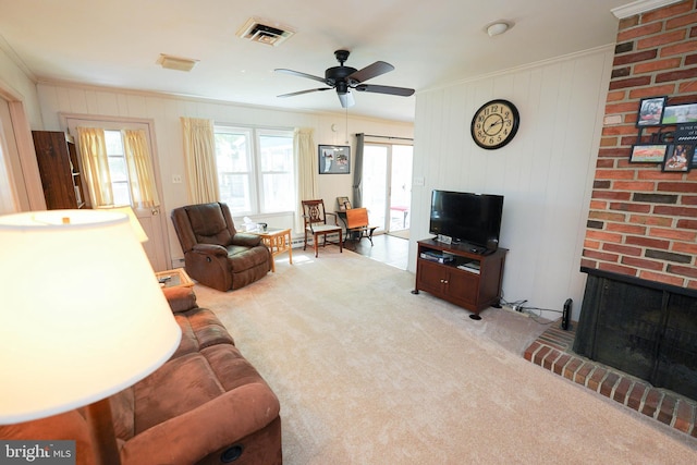 carpeted living room with visible vents, ornamental molding, a fireplace, baseboard heating, and a ceiling fan