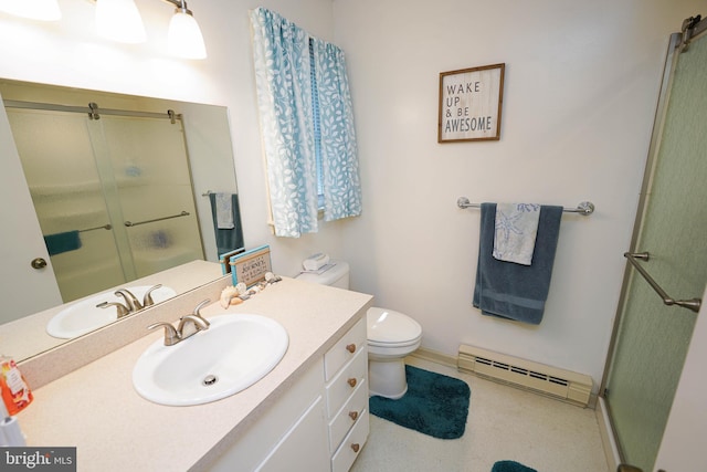bathroom with a shower with shower door, vanity, baseboards, a baseboard heating unit, and toilet