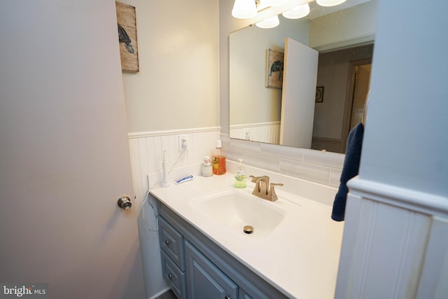 bathroom with vanity and wainscoting