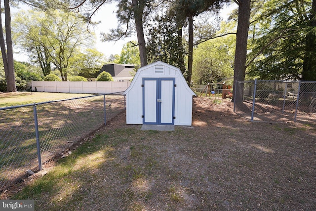 view of shed with a fenced backyard