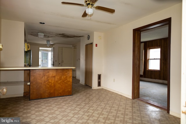 4398 S Bowers Rd, Milford, DE 19963 - kitchen with plenty of natural light, light floors, ceiling fan, and a peninsula