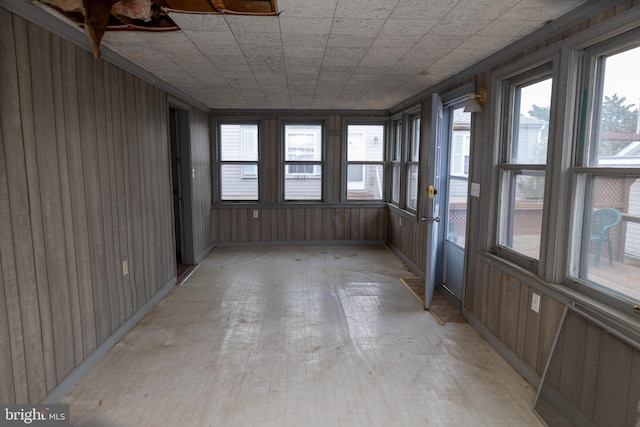 4398 S Bowers Rd, Milford, DE 19963 - unfurnished sunroom featuring wooden walls and baseboards