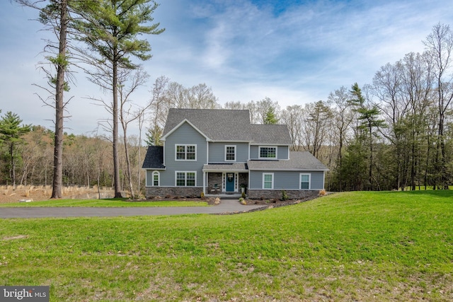 131 Chinaberry Way, Kunkletown, PA 18058 - craftsman house with a shingled roof, a front lawn, and stone siding