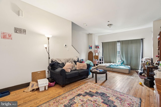 living area with hardwood / wood-style flooring