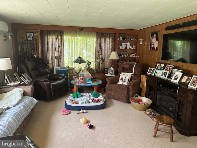 living room with wood walls and carpet