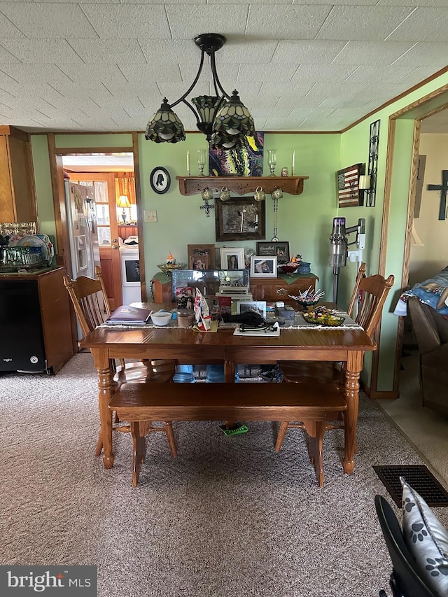 view of carpeted dining room