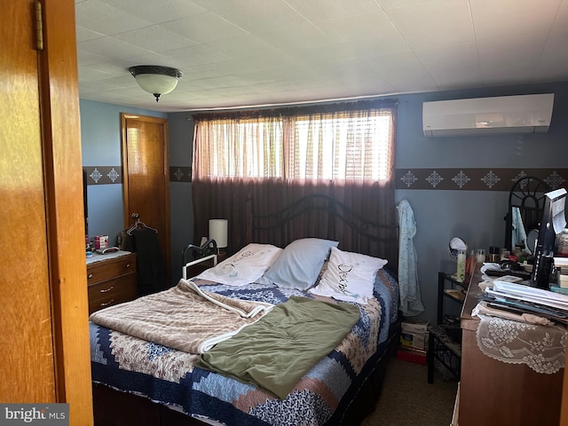 bedroom with a wall unit AC