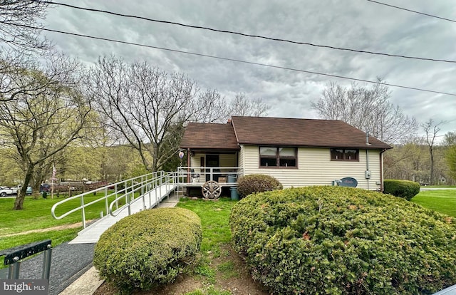 exterior space with a porch and a front lawn