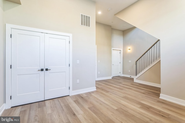 208 Kalos St, Philadelphia, PA 19128 - entrance foyer featuring stairway, baseboards, light wood finished floors, and visible vents