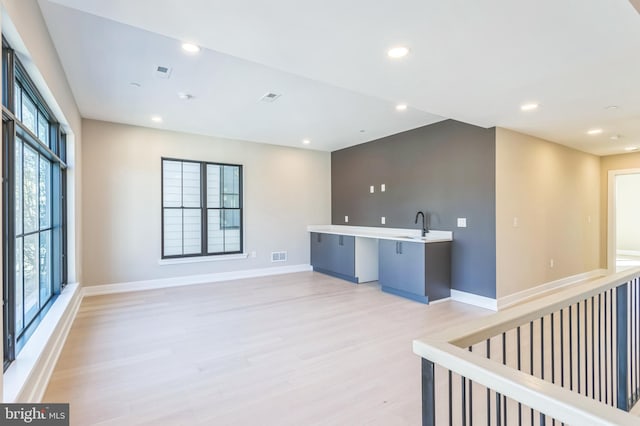 208 Kalos St, Philadelphia, PA 19128 - interior space with light countertops, baseboards, light wood finished floors, and a sink