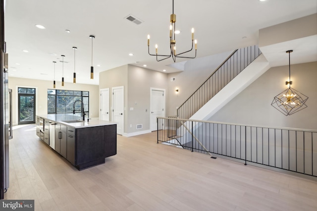 208 Kalos St, Philadelphia, PA 19128 - kitchen with an inviting chandelier, visible vents, light wood-style floors, a spacious island, and a sink