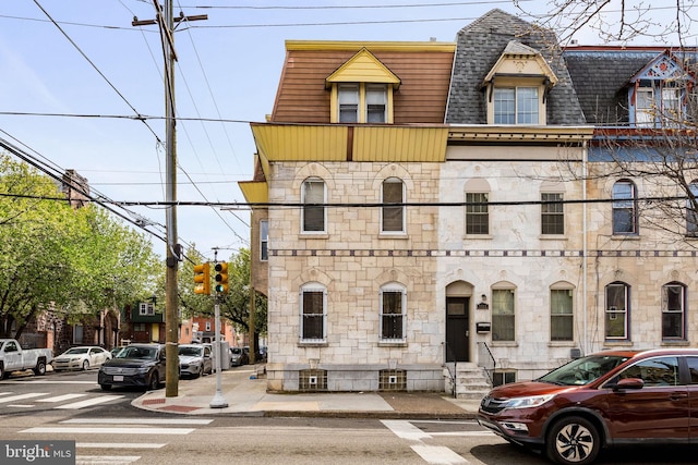 3800 Spring Garden St, Philadelphia, PA 19104 - view of front of property with entry steps, mansard roof, stone siding, and roof with shingles