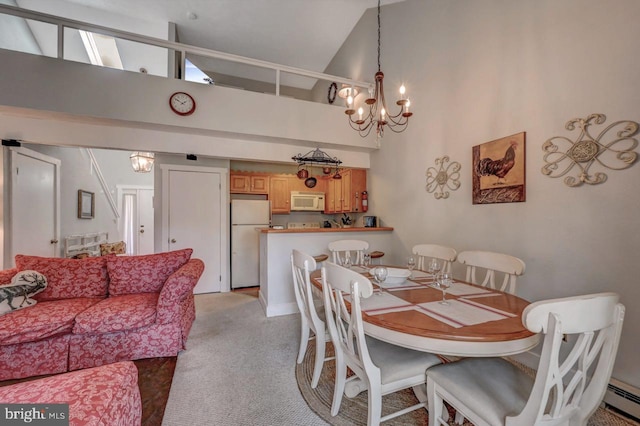 116 Snow Ridge Cir, Lake Harmony, PA 18624 - dining space featuring high vaulted ceiling, a baseboard radiator, light colored carpet, and a notable chandelier