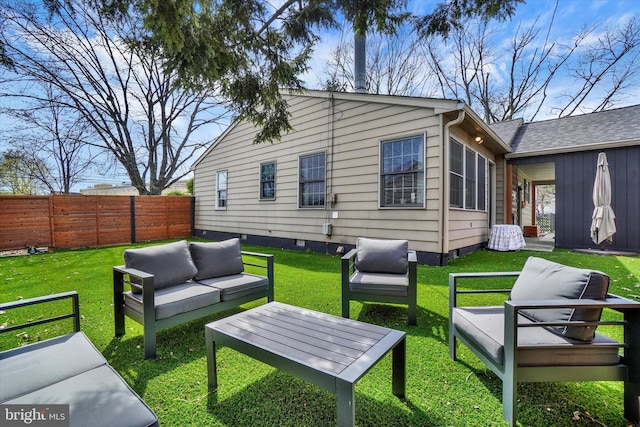 rear view of property with an outdoor hangout area, fence, a yard, and crawl space