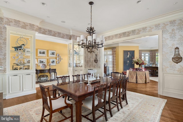 8620 Bozman Neavitt, Saint Michaels, MD 21663 - dining space with wallpapered walls, an inviting chandelier, wood finished floors, and a wainscoted wall