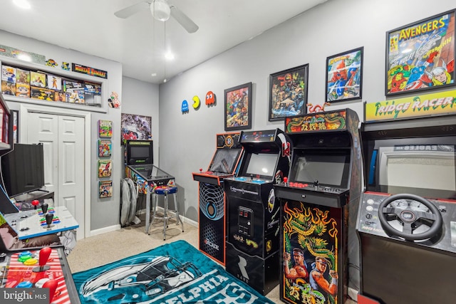 rec room featuring carpet flooring, a ceiling fan, and baseboards