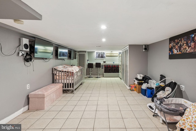 living area with recessed lighting and light tile patterned floors