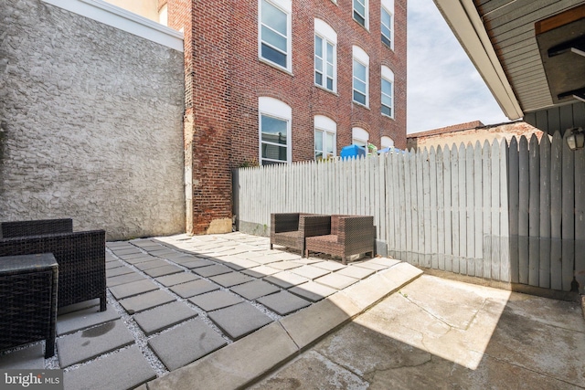view of patio featuring fence