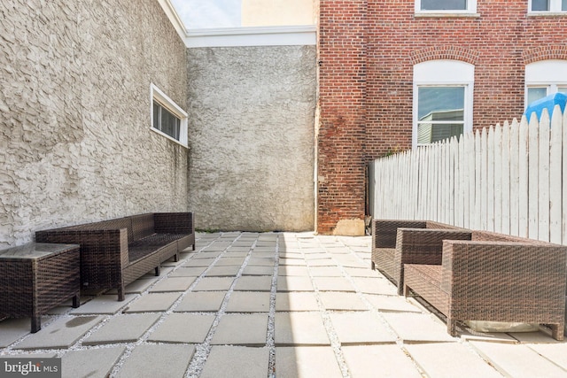 view of patio featuring fence