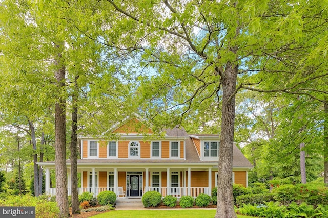 22758 Red Bay Ln, Milton, DE 19968 - colonial inspired home with a porch and roof with shingles