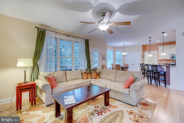 22758 Red Bay Ln, Milton, DE 19968 - living area featuring baseboards, light wood-style flooring, a ceiling fan, and recessed lighting