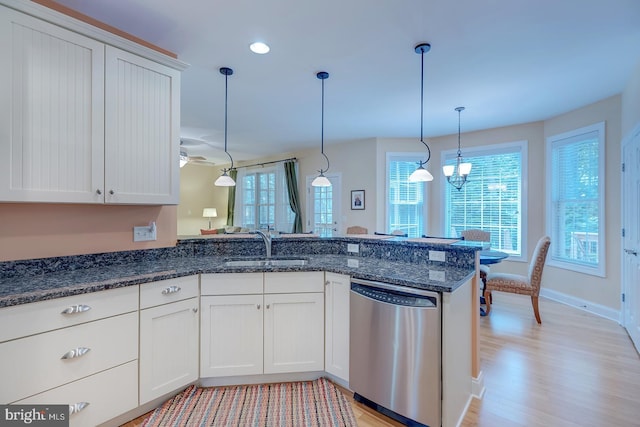 22758 Red Bay Ln, Milton, DE 19968 - kitchen featuring dishwasher, a sink, white cabinetry, a peninsula, and light wood-style floors
