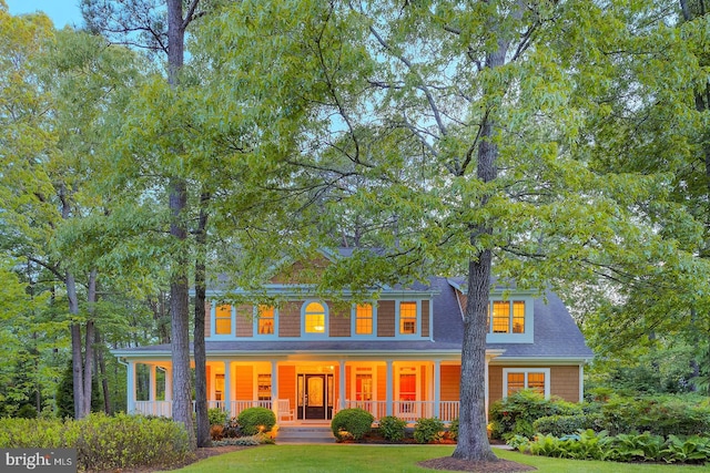 22758 Red Bay Ln, Milton, DE 19968 - colonial inspired home with a porch and a front lawn