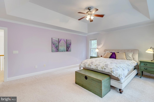 22758 Red Bay Ln, Milton, DE 19968 - bedroom featuring a tray ceiling, carpet floors, ornamental molding, baseboards, and ceiling fan