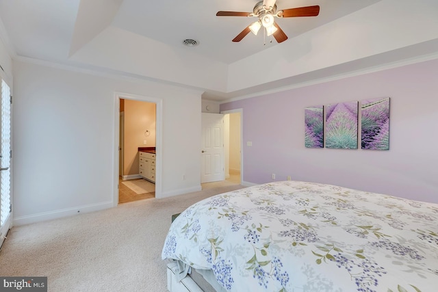 22758 Red Bay Ln, Milton, DE 19968 - carpeted bedroom featuring baseboards, multiple windows, a raised ceiling, ensuite bathroom, and crown molding