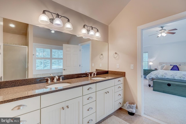 22758 Red Bay Ln, Milton, DE 19968 - ensuite bathroom featuring vaulted ceiling, healthy amount of natural light, double vanity, ceiling fan, and tile patterned floors