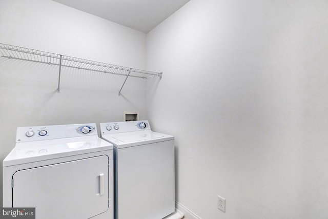 22758 Red Bay Ln, Milton, DE 19968 - washroom featuring washing machine and dryer and baseboards