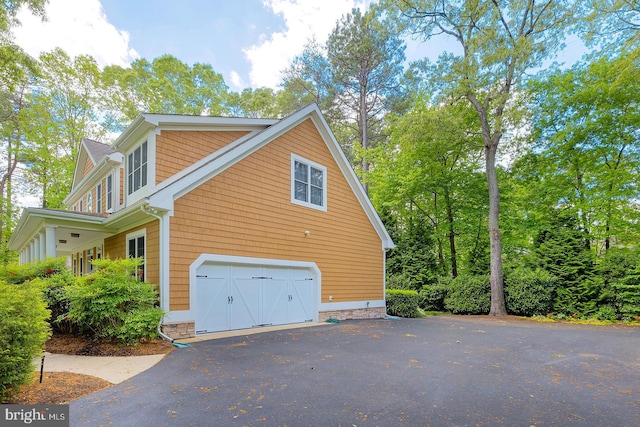 22758 Red Bay Ln, Milton, DE 19968 - view of property exterior featuring driveway and an attached garage