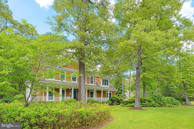 22758 Red Bay Ln, Milton, DE 19968 - view of front facade featuring a porch and a front yard
