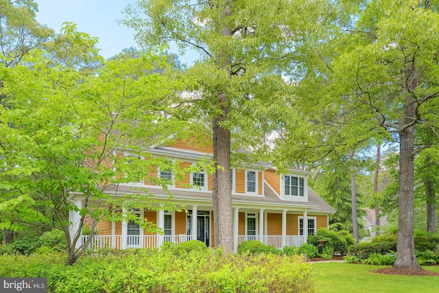 22758 Red Bay Ln, Milton, DE 19968 - view of front of house featuring a porch and a shingled roof