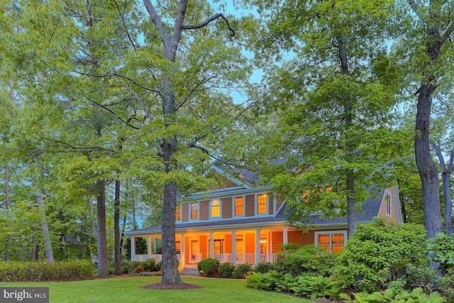 22758 Red Bay Ln, Milton, DE 19968 - colonial home featuring covered porch and a front yard